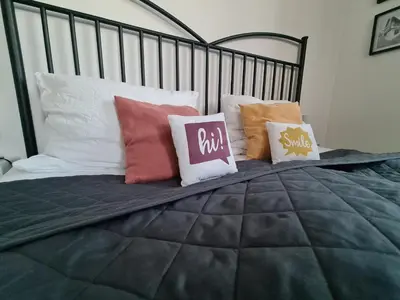 Ein Bett oder Betten in einem Zimmer der Unterkunft Zentral gelegene Ferienwohnung im Herzen der Pfalz