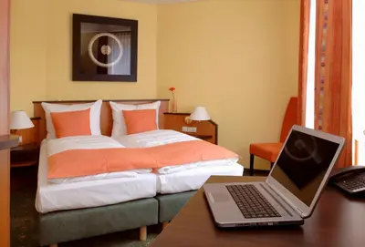 Ein Bett oder Betten in einem Zimmer der Unterkunft Hotel Sperling mit E-Ladestation