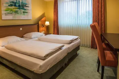 Ein Bett oder Betten in einem Zimmer der Unterkunft Hotel Sperling mit E-Ladestation