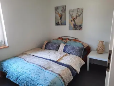 Ein Bett oder Betten in einem Zimmer der Unterkunft Ferienhaus auf dem Lusitanohof Jäger