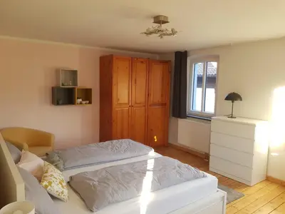Ein Bett oder Betten in einem Zimmer der Unterkunft Ferienhaus Anno 1903