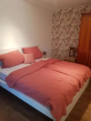 Ein Bett oder Betten in einem Zimmer der Unterkunft Ferienhaus Anno 1903