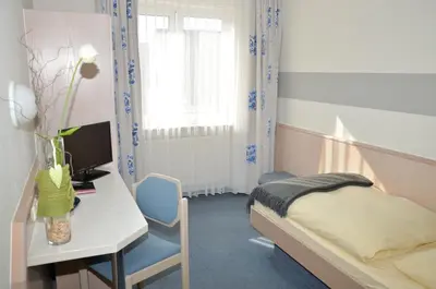 Ein Bett oder Betten in einem Zimmer der Unterkunft Hotel Hamm
