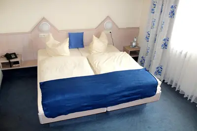 Ein Bett oder Betten in einem Zimmer der Unterkunft Hotel Hamm