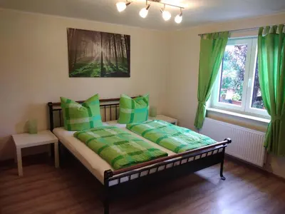 Ein Bett oder Betten in einem Zimmer der Unterkunft Untere Ferienwohnung Asshoff in Ahorn