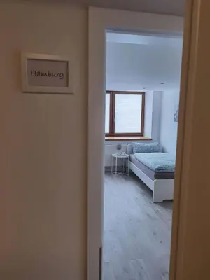 Ein Bett oder Betten in einem Zimmer der Unterkunft Main Appartement-Haus - 97896 Freudenberg