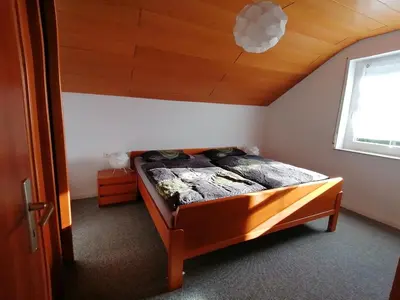 Ein Bett oder Betten in einem Zimmer der Unterkunft Ferienwohnung Max und Moritz