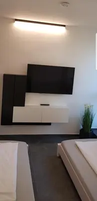 Ein Bett oder Betten in einem Zimmer der Unterkunft Joanna Apartment - MA Lindenhof