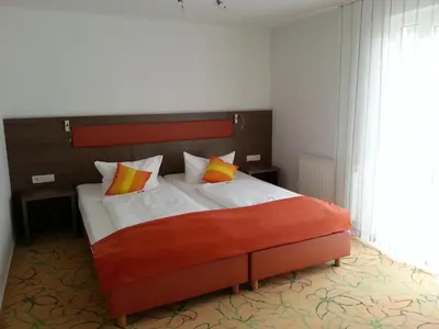Ein Bett oder Betten in einem Zimmer der Unterkunft Hotel AVIVA by APOLONIA