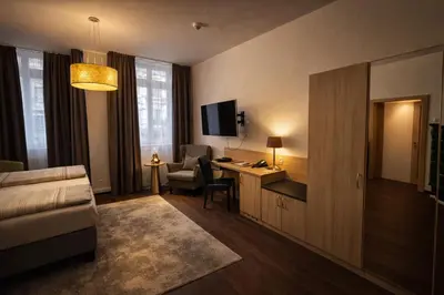 Ein Bett oder Betten in einem Zimmer der Unterkunft Hotel Bayrischer Hof