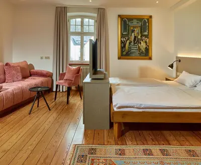 Ein Bett oder Betten in einem Zimmer der Unterkunft Hotel & Restaurant Burgschänke