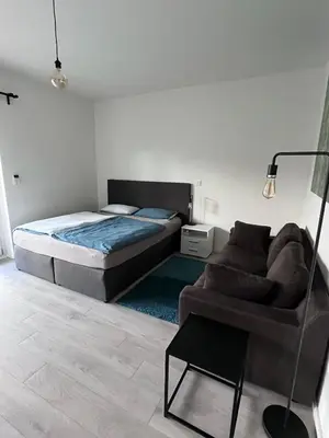 Ein Bett oder Betten in einem Zimmer der Unterkunft Forststrasse Apartment