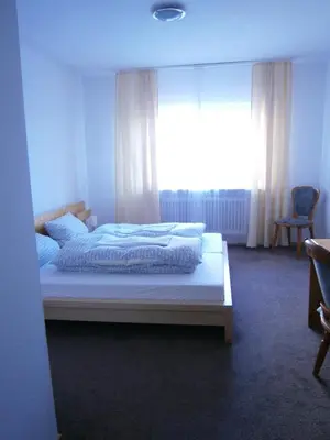 Ein Bett oder Betten in einem Zimmer der Unterkunft Hotel Strauss