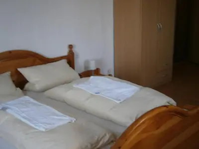 Ein Bett oder Betten in einem Zimmer der Unterkunft Hotel Strauss