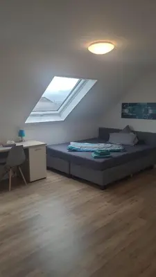 Ein Bett oder Betten in einem Zimmer der Unterkunft Boardinghouse Heilbronn