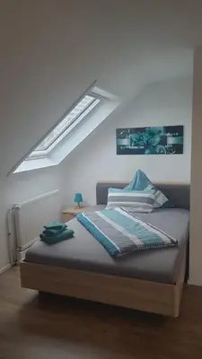 Ein Bett oder Betten in einem Zimmer der Unterkunft Boardinghouse Heilbronn