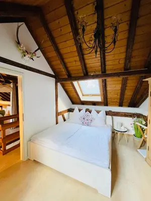 Ein Bett oder Betten in einem Zimmer der Unterkunft Ferienhaus Zur Hofreite