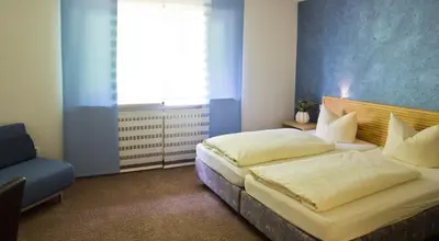Ein Bett oder Betten in einem Zimmer der Unterkunft Hotel Berg