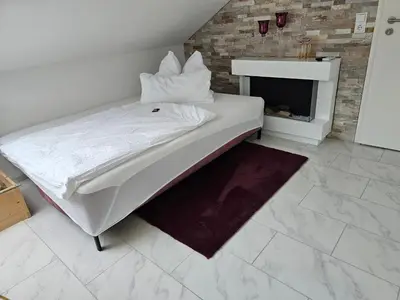 Ein Bett oder Betten in einem Zimmer der Unterkunft Stengels Sekt Appartements
