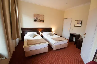 Ein Bett oder Betten in einem Zimmer der Unterkunft Linde Restaurant & Hotel