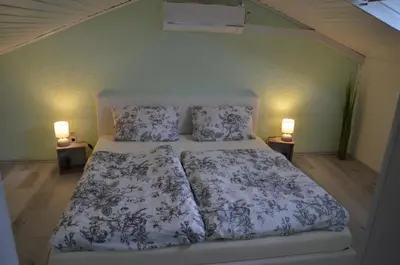 Ein Bett oder Betten in einem Zimmer der Unterkunft PalmGarden