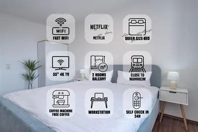 Ein Bett oder Betten in einem Zimmer der Unterkunft Schöne 2 Zimmerwohnung mit UHD-TV, großem Balkon und Hängematte