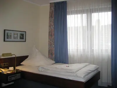 Ein Bett oder Betten in einem Zimmer der Unterkunft Central Hotel
