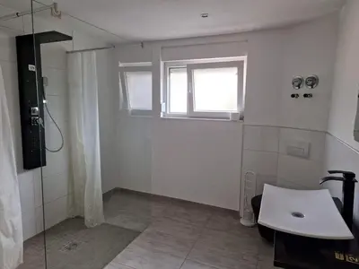 Ein Badezimmer in der Unterkunft Ferienwohnungen Löwe