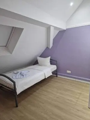 Ein Bett oder Betten in einem Zimmer der Unterkunft Ferienwohnungen Löwe