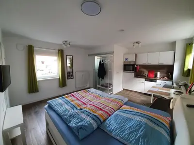 Ein Bett oder Betten in einem Zimmer der Unterkunft Ferienwohnung Raiffeisenstraße - Obernburg