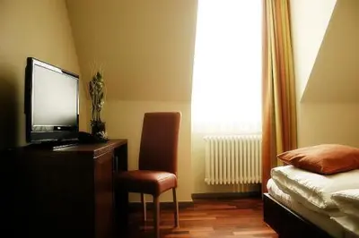 Ein Bett oder Betten in einem Zimmer der Unterkunft Hotel am Kulturplatz