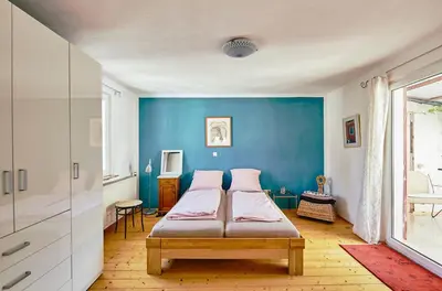 Ein Bett oder Betten in einem Zimmer der Unterkunft Ferienhaus CASA PI mit Gemeinschaftgarten