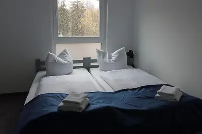 Ein Bett oder Betten in einem Zimmer der Unterkunft Boardinghouse - Alte Mühle