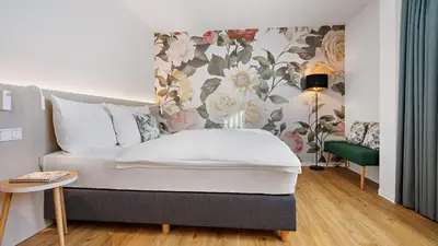 Ein Bett oder Betten in einem Zimmer der Unterkunft Hey Lou Hotel Karlsruhe Messe