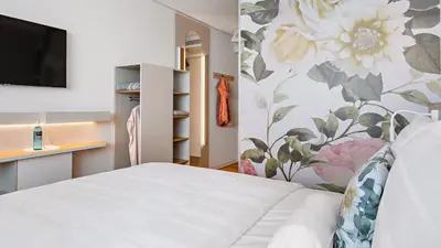 Ein Bett oder Betten in einem Zimmer der Unterkunft Hey Lou Hotel Karlsruhe Messe