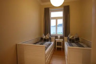 Ein Bett oder Betten in einem Zimmer der Unterkunft Ferienwohnung Altes Pfarrhaus Bargen
