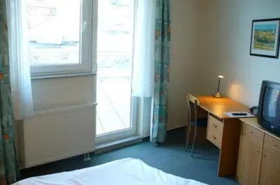 Ein Bett oder Betten in einem Zimmer der Unterkunft Hotel Ernst Ludwig