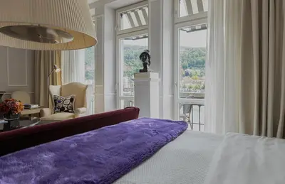 Ein Bett oder Betten in einem Zimmer der Unterkunft House of Hütter- Heidelberg Suites Boutique