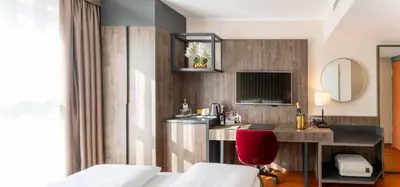 Ein Bett oder Betten in einem Zimmer der Unterkunft PLAZA Premium Karlsruhe