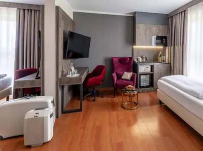 Ein Bett oder Betten in einem Zimmer der Unterkunft PLAZA Premium Karlsruhe