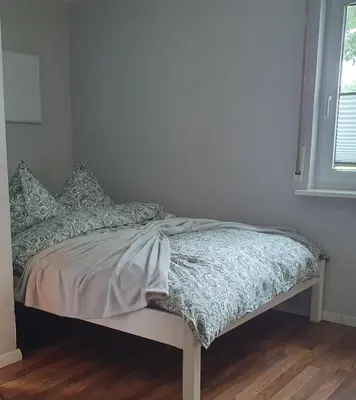Ein Bett oder Betten in einem Zimmer der Unterkunft Ferienwohnung Haiber - Remseck