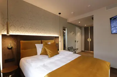 Ein Bett oder Betten in einem Zimmer der Unterkunft REINHARDTs HOTEL