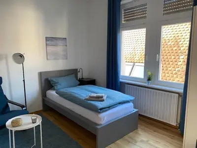 Ein Bett oder Betten in einem Zimmer der Unterkunft Gästehaus Windheim Ettlingen Stadt