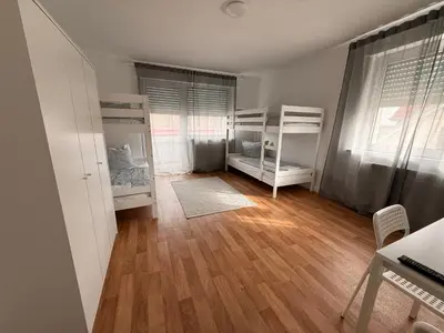 Ein Bett oder Betten in einem Zimmer der Unterkunft Ferienwohnungen Uhrturm
