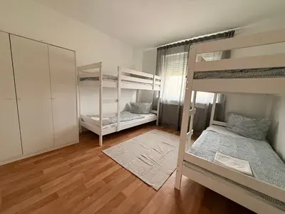 Ein Bett oder Betten in einem Zimmer der Unterkunft Ferienwohnungen Uhrturm