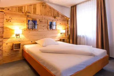 Ein Bett oder Betten in einem Zimmer der Unterkunft Jäger's Landhaus Rössle