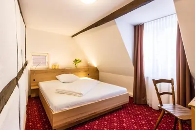 Ein Bett oder Betten in einem Zimmer der Unterkunft Jäger's Landhaus Rössle