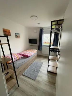 Ein Bett oder Betten in einem Zimmer der Unterkunft Ferienwohnung Raiffeisenstraße -groß-