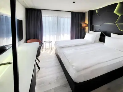 Ein Bett oder Betten in einem Zimmer der Unterkunft DORMERO Hotel Aschaffenburg