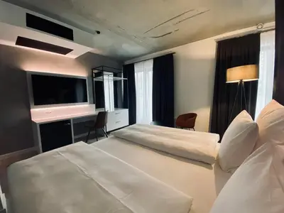 Ein Bett oder Betten in einem Zimmer der Unterkunft DORMERO Hotel Aschaffenburg